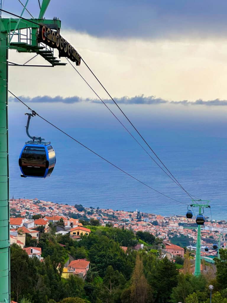 View of madeira city and ocean with cable cars